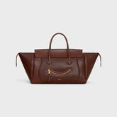 MEDIUM SMILING NEW LUGGAGE IN SUPPLE SHINY LAMBSKIN DEEP BROWN