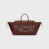 MEDIUM SMILING NEW LUGGAGE IN SUPPLE SHINY LAMBSKIN DEEP BROWN